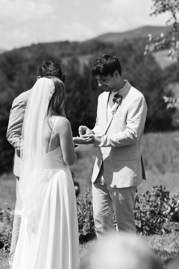 bride and groom exchanging rings
