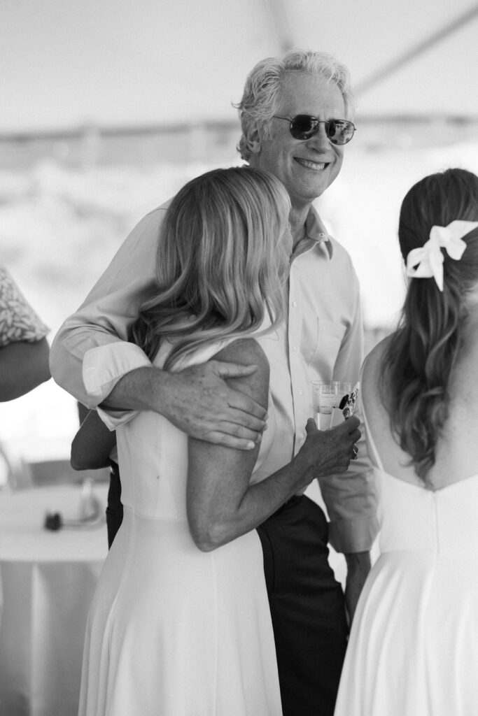 man and woman hugging and laughing