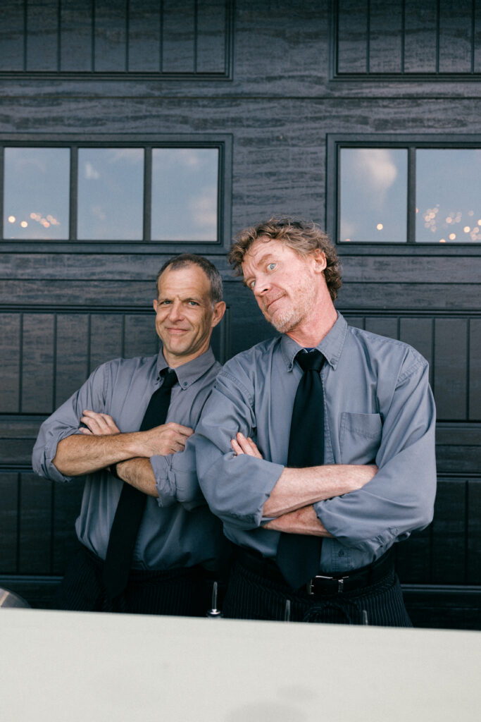 bartenders posing for the camera at a wedding