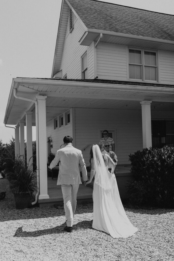 couple walking into house