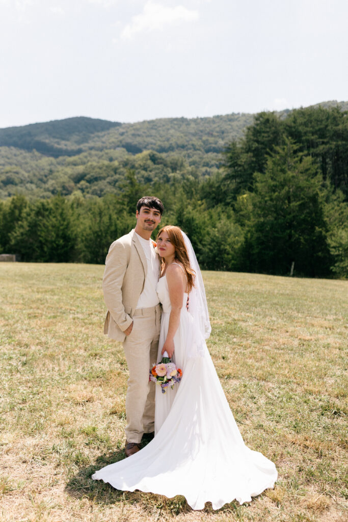 bride and groom posing for camera