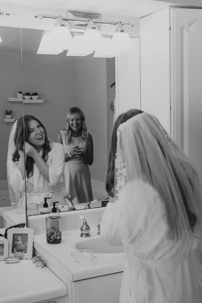bride putting on earring