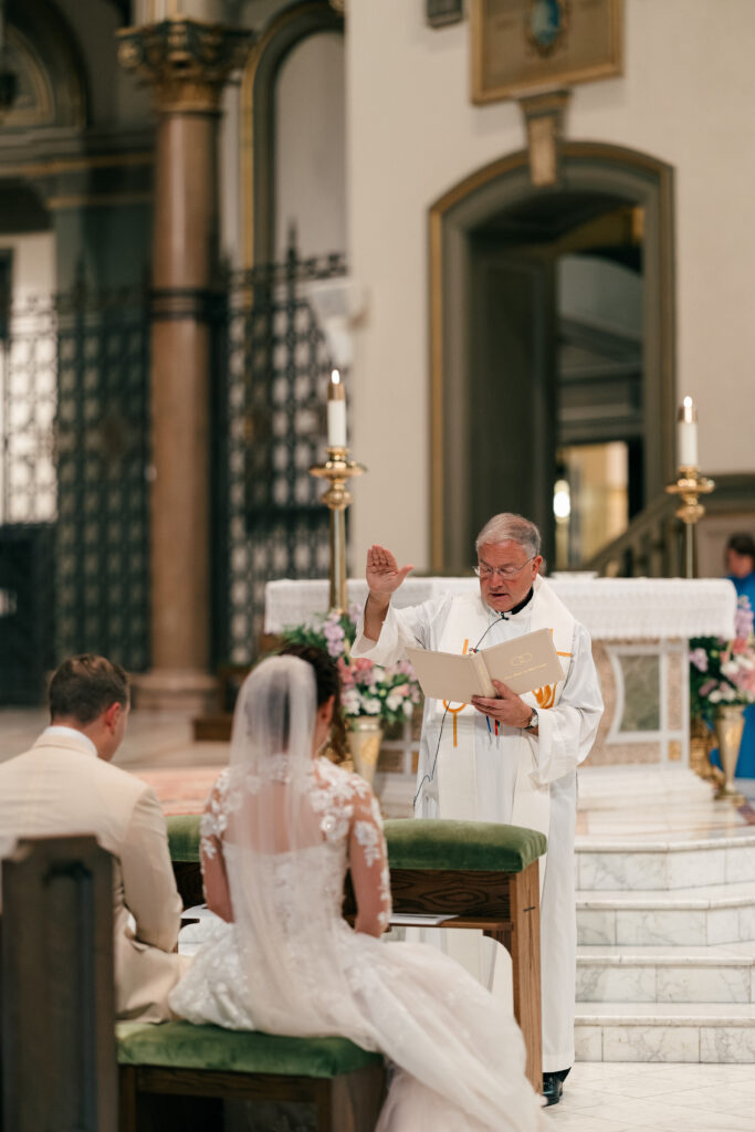 pastor blessing couple at wedding