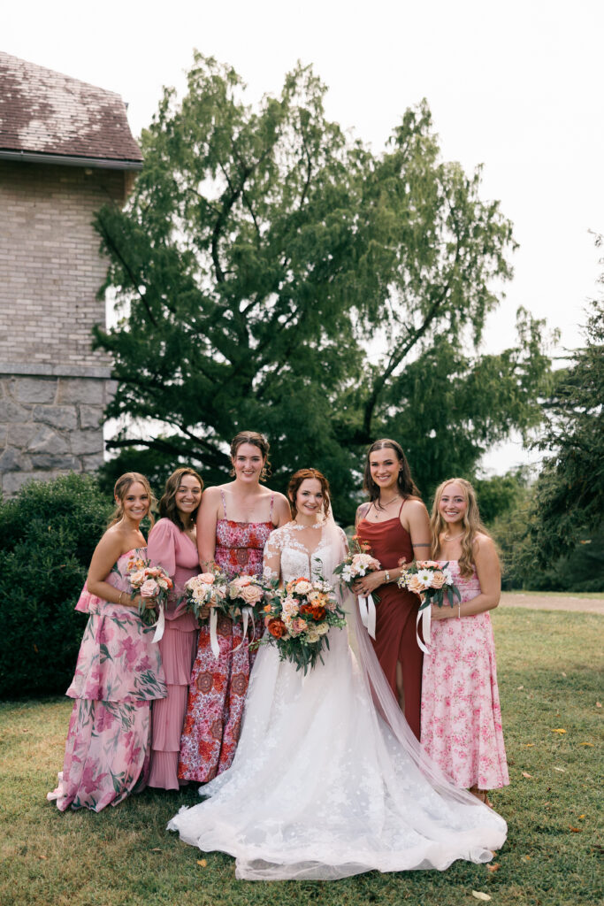 bride and bridesmaids with flowers