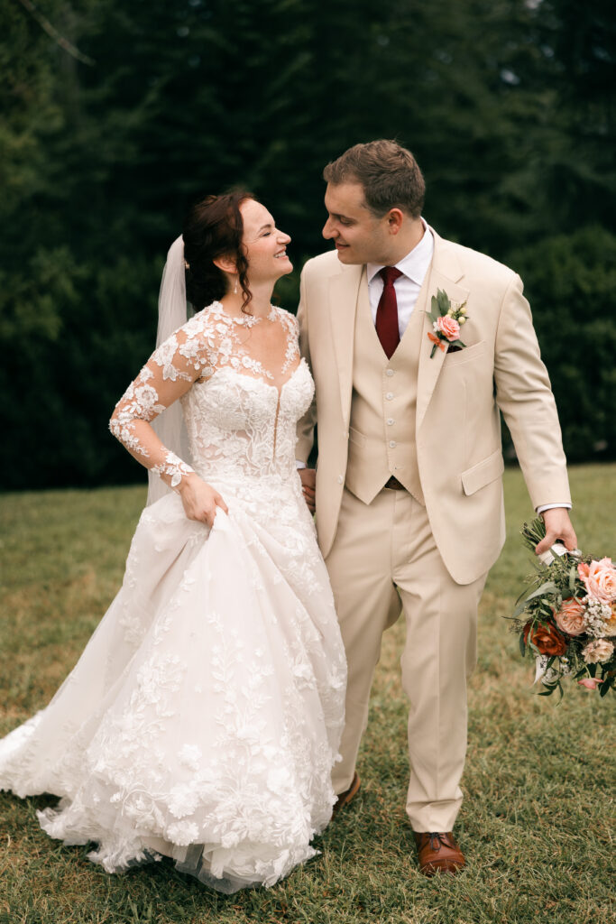 bride and groom looking at each other walking