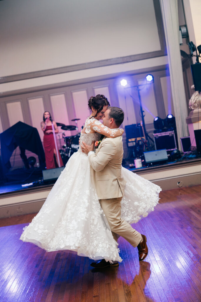 groom spinning bride around