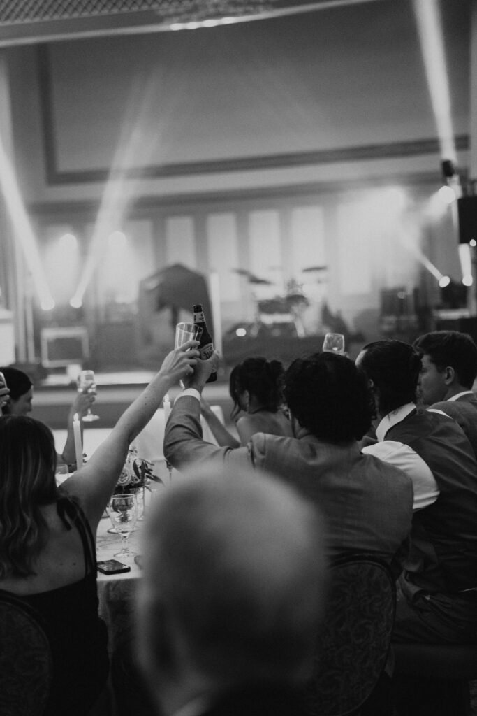 guests toasting their glasses