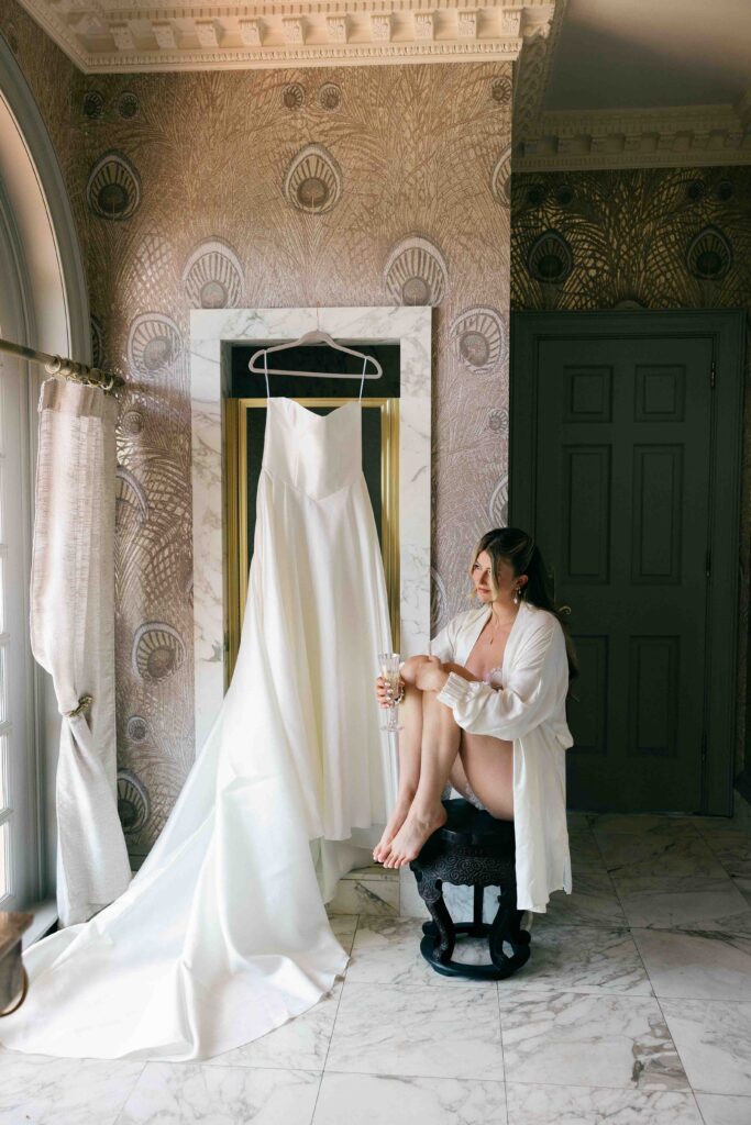 bride sitting with champagne